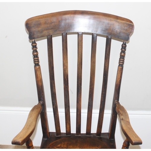 46 - An antique slat back farmhouse Windsor armchair and an antique upholstered bedroom chair with stick ... 