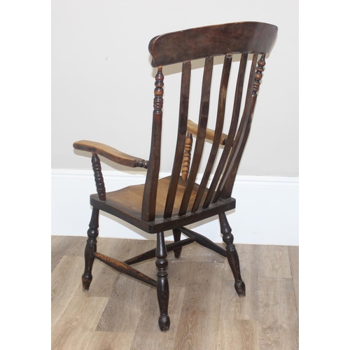 46 - An antique slat back farmhouse Windsor armchair and an antique upholstered bedroom chair with stick ... 