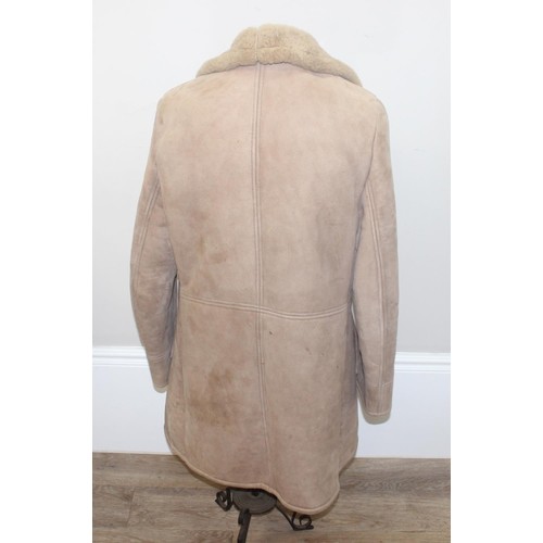 213 - A vintage Mary Quant waterproof poncho or cape, A vintage double-breasted sheepskin coat, label for ... 