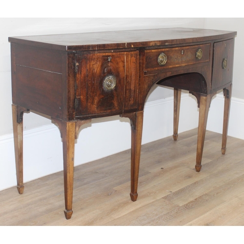 85 - A Georgian mahogany bow front sideboard, with frieze drawer flanked by a cupboard and a cellarette d... 