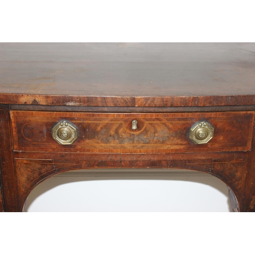 85 - A Georgian mahogany bow front sideboard, with frieze drawer flanked by a cupboard and a cellarette d... 