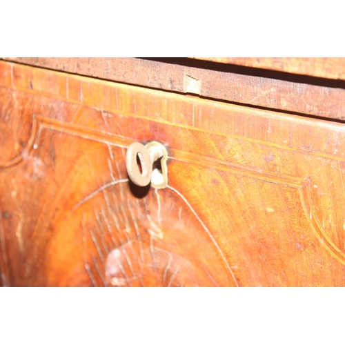 85 - A Georgian mahogany bow front sideboard, with frieze drawer flanked by a cupboard and a cellarette d... 