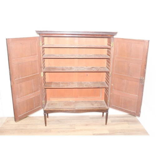 22 - A Georgian mahogany hall cupboard on stand, 2 large doors concealing 4 adjustable shelves, approx 11... 