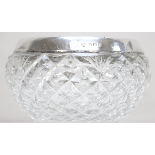 1055 - A silver rimmed and cut glass footed bowl, Birmingham 1926 by Selfridge & Co Ltd, approx 13cm in dia... 