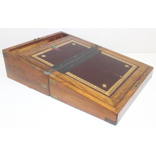 318 - Antique Walnut and brass bound writing slope with hidden draws and a deep red leather interior, and ... 