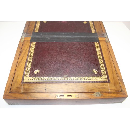 318 - Antique Walnut and brass bound writing slope with hidden draws and a deep red leather interior, and ... 