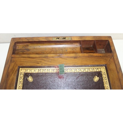 318 - Antique Walnut and brass bound writing slope with hidden draws and a deep red leather interior, and ... 