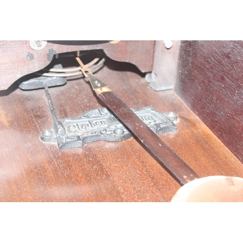 1322 - Vintage oak cased mechanical wall clock with bevelled glass panels, approx 60cm