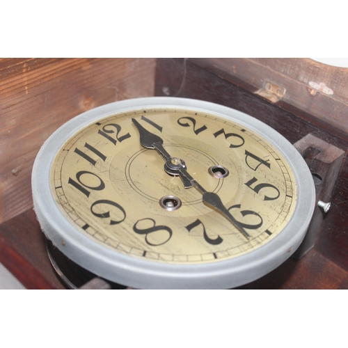 1322 - Vintage oak cased mechanical wall clock with bevelled glass panels, approx 60cm