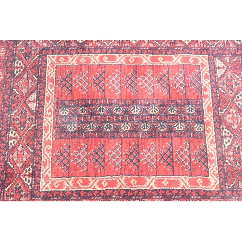 215 - A modern red ground rug by Super Taj, approx 160cm x 84cm, and one other