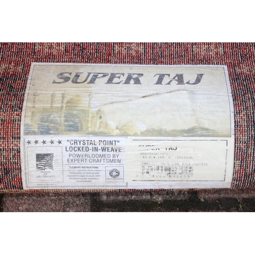 215 - A modern red ground rug by Super Taj, approx 160cm x 84cm, and one other