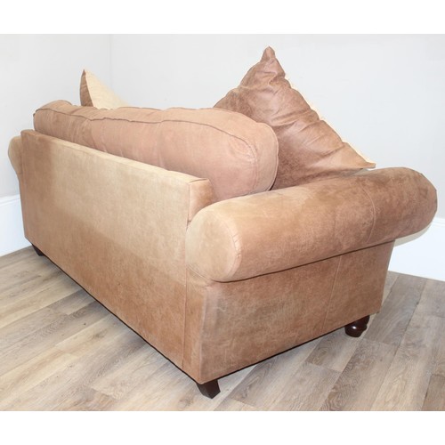 37 - A good quality modern brown suede leather sofa and a number of decorative cushions, approx 222cm wid... 