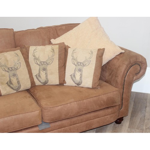 37 - A good quality modern brown suede leather sofa and a number of decorative cushions, approx 222cm wid... 