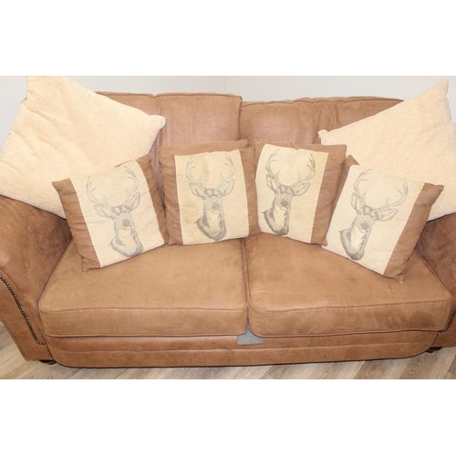 37 - A good quality modern brown suede leather sofa and a number of decorative cushions, approx 222cm wid... 