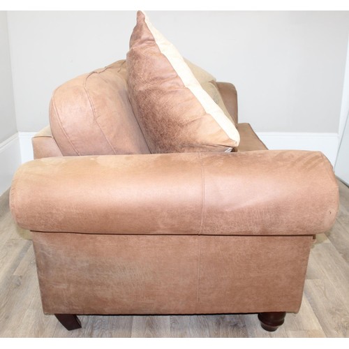 37 - A good quality modern brown suede leather sofa and a number of decorative cushions, approx 222cm wid... 