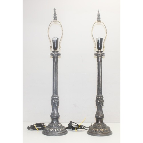 255 - 3 pairs of metal table lamps to include a pair of distressed metal effect table lamps formed as ioni... 