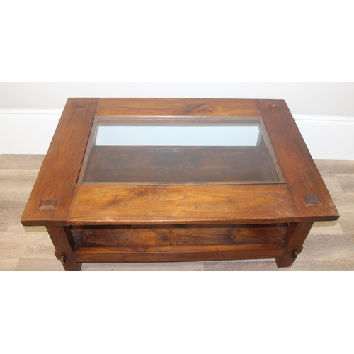 34 - A vintage reclaimed hard wood coffee table with glass central panel, approx 120cm wide x 90cm deep x... 