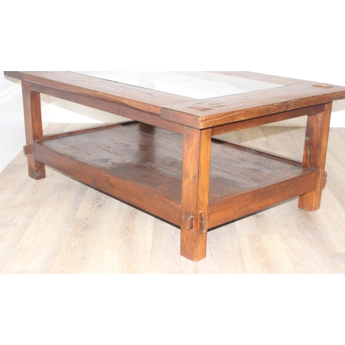 34 - A vintage reclaimed hard wood coffee table with glass central panel, approx 120cm wide x 90cm deep x... 