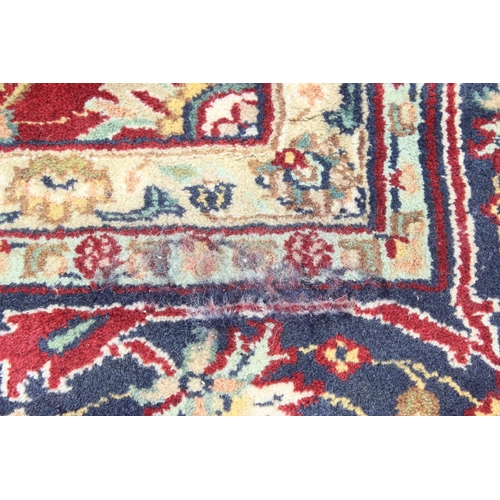 217 - An extremely large red ground Persian rug, approx 420cm x 305cm