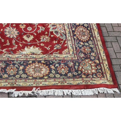 217 - An extremely large red ground Persian rug, approx 420cm x 305cm