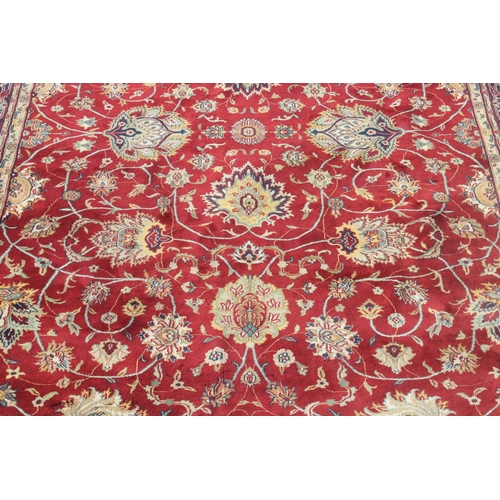 217 - An extremely large red ground Persian rug, approx 420cm x 305cm