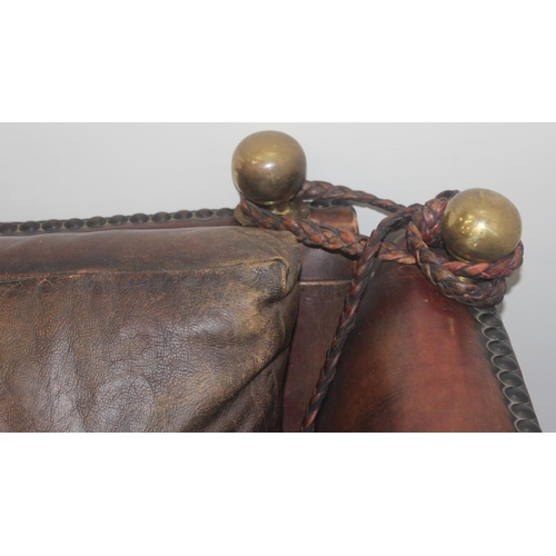 59 - A good quality antique style brown leather Knole sofa with drop ends, brass ball finials with knotte... 