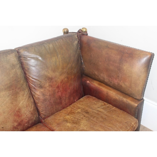 59 - A good quality antique style brown leather Knole sofa with drop ends, brass ball finials with knotte... 