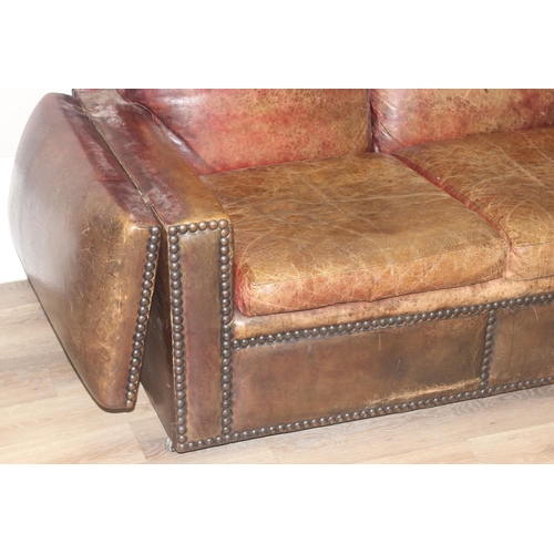 59 - A good quality antique style brown leather Knole sofa with drop ends, brass ball finials with knotte... 