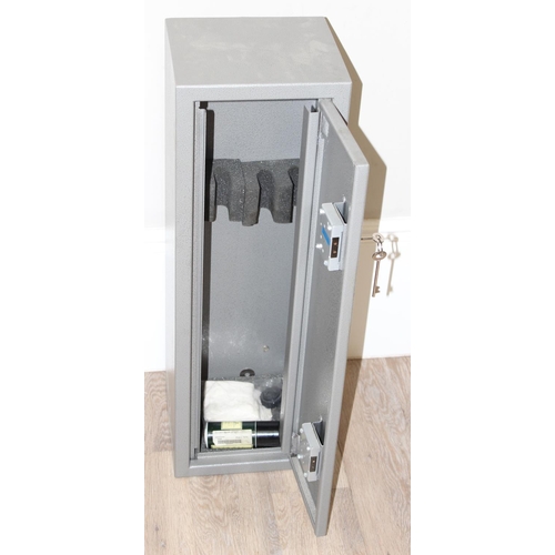 1416 - Grey metal gun cabinet with two keys, approx 27cm x 24cm x 84cm