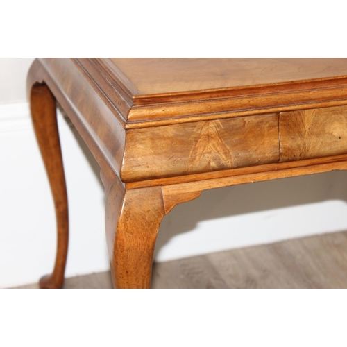 107 - A Queen Anne style walnut low table with cabriole legs and small single drawer, approx 70cm wide x 5... 