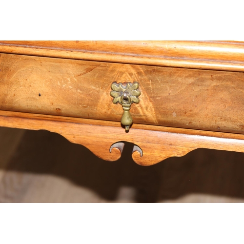 107 - A Queen Anne style walnut low table with cabriole legs and small single drawer, approx 70cm wide x 5... 