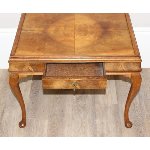 107 - A Queen Anne style walnut low table with cabriole legs and small single drawer, approx 70cm wide x 5... 