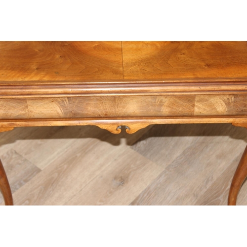 107 - A Queen Anne style walnut low table with cabriole legs and small single drawer, approx 70cm wide x 5... 