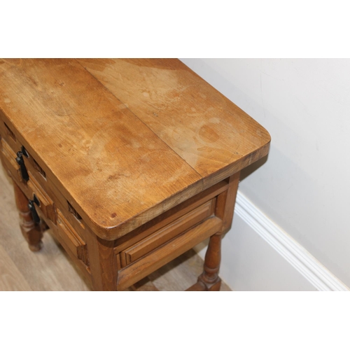 161 - Antique style stained beech bedside table with 2 drawers and iron drop handles, approx 62cm x 37cm x... 