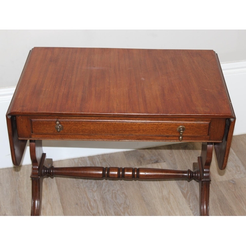 160 - Mahogany extending sofa table with drawer and turned cross support and a vintage tapestry topped tab... 