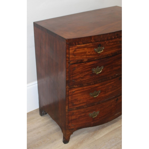 165 - A Victorian mahogany bow fronted 2 over 3 chest of drawers with brass drop handles, bracket feet and... 