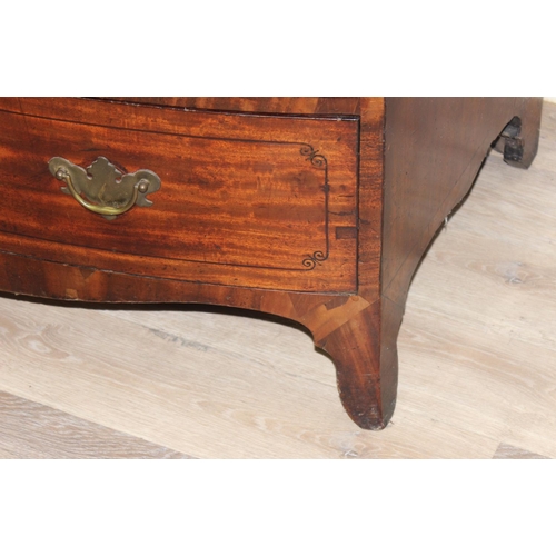 165 - A Victorian mahogany bow fronted 2 over 3 chest of drawers with brass drop handles, bracket feet and... 