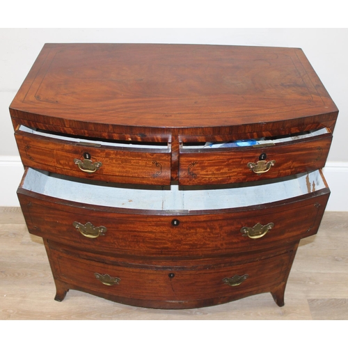 165 - A Victorian mahogany bow fronted 2 over 3 chest of drawers with brass drop handles, bracket feet and... 