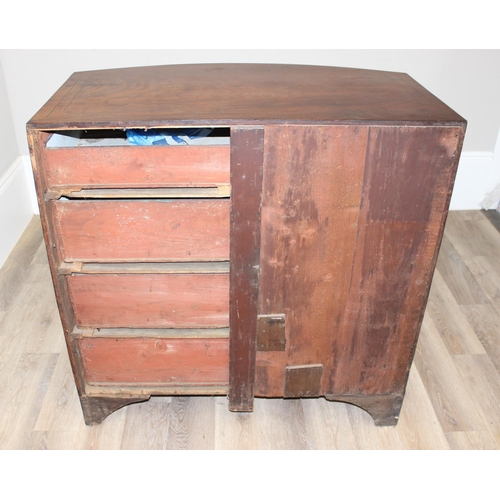 165 - A Victorian mahogany bow fronted 2 over 3 chest of drawers with brass drop handles, bracket feet and... 