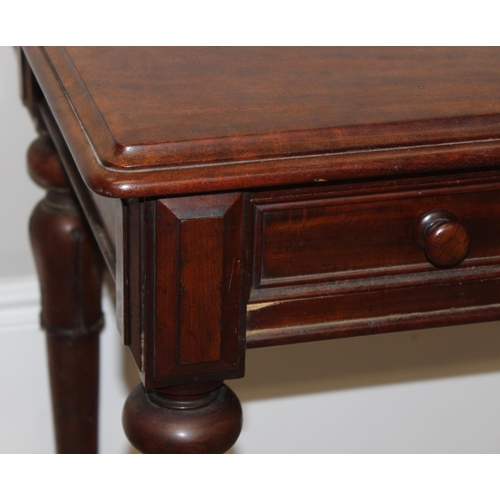 153 - A 19th century mahogany hall table or desk with 2 drawers, turned wooden handles and impressive carv... 