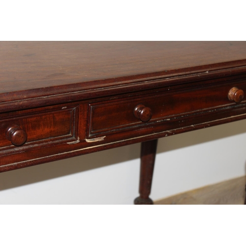 153 - A 19th century mahogany hall table or desk with 2 drawers, turned wooden handles and impressive carv... 