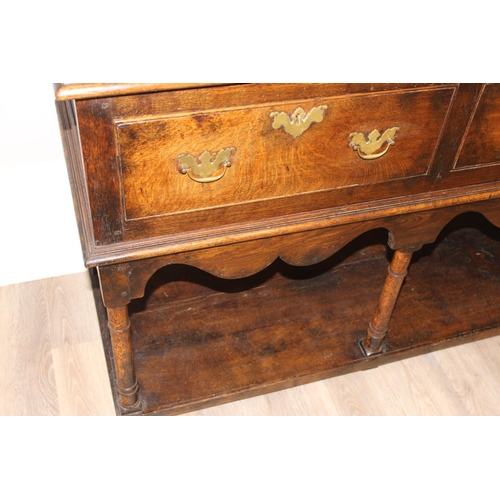 137 - A George III style oak 3 drawer sideboard or dresser base with brass handles, approx 185cm wide x 51... 