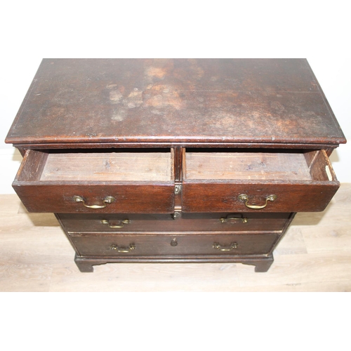 162 - A Georgian oak 2 over 3 chest of drawers with brass handles and bracket feet, ivorine label to drawe... 