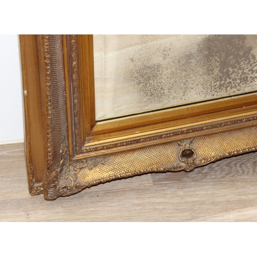 491 - Large vintage wall mirror with marble effect Rococo style plaque above, set in decorative gilt frame... 