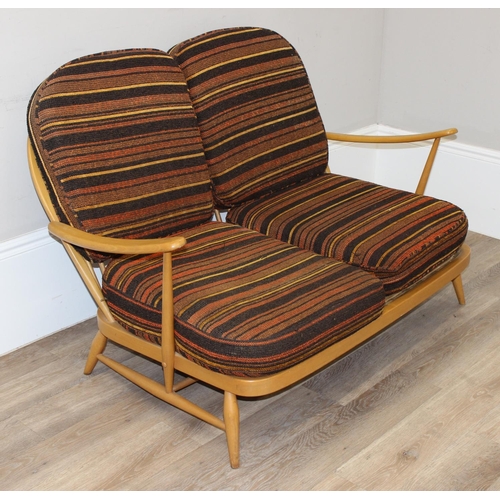 5 - Ercol - a retro 2 seater sofa with mid-century coloured cushions, believed to be a model 203 from th... 