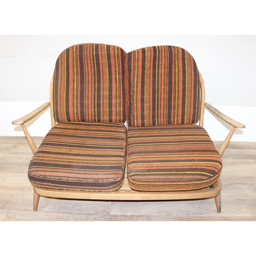 6 - Ercol - a retro 2 seater sofa with mid-century coloured cushions, believed to be a model 203 from th... 