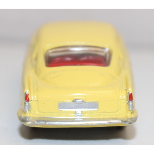 680 - Vintage Corgi Toys Aston Martin D.B.4 (218) diecast scale model in yellow with red interior, with or... 