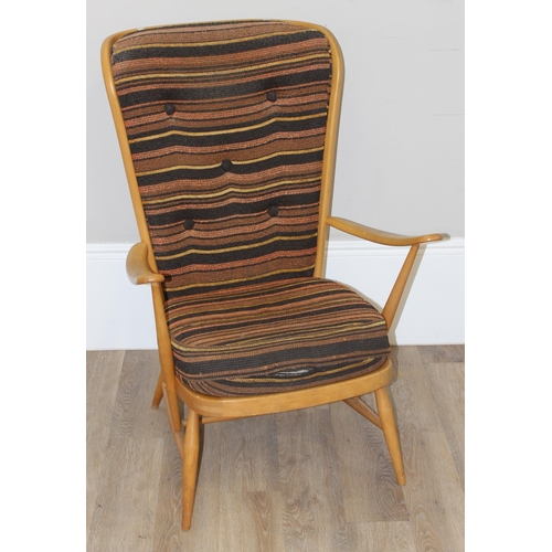 7 - Ercol - a retro high backed armchair with mid-century coloured cushions, believed to be a model 478 ... 