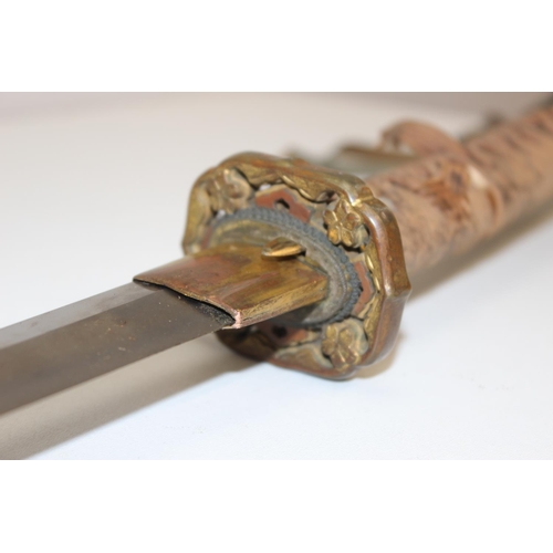 1400 - A vintage Japanese samurai sword, believed to be a c.WW2 period officers sword, with painted sheath,... 