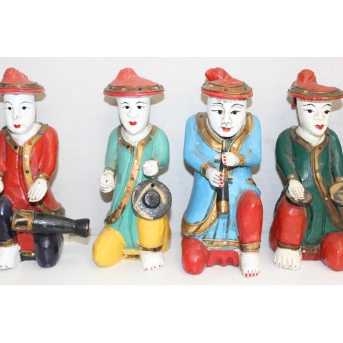 1670 - A set of 6 Oriental carved wooden figures with polychrome decoration, likely a band, the largest app... 